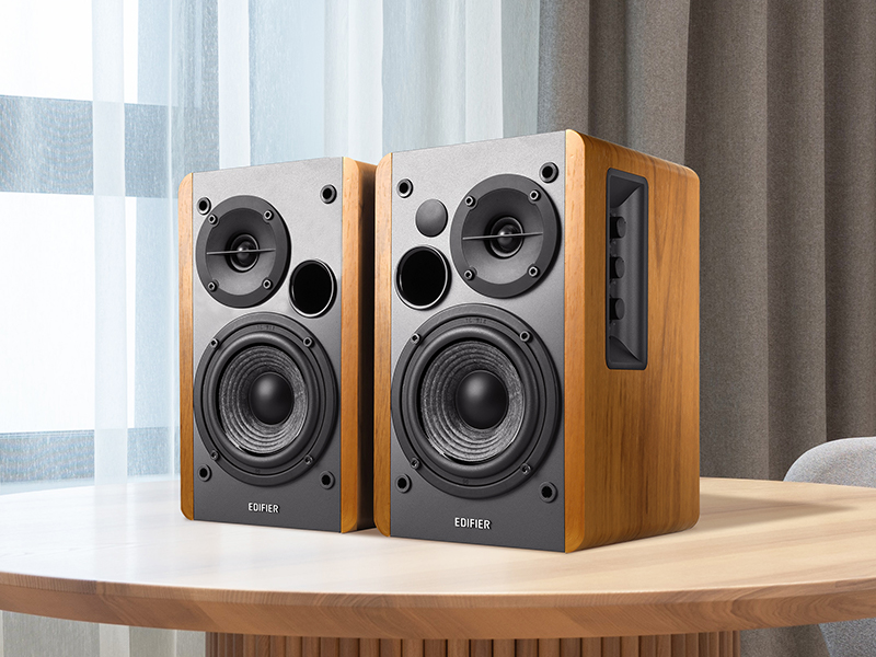 2 cEdifier R1280T Powered Bookshelf Speakers placed on a table