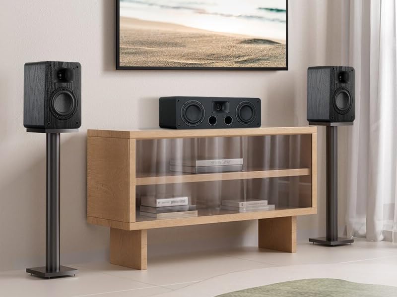 Passive bookshelf speakers set up in a room