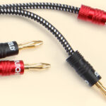 Different speaker wires isolated on a yellow background