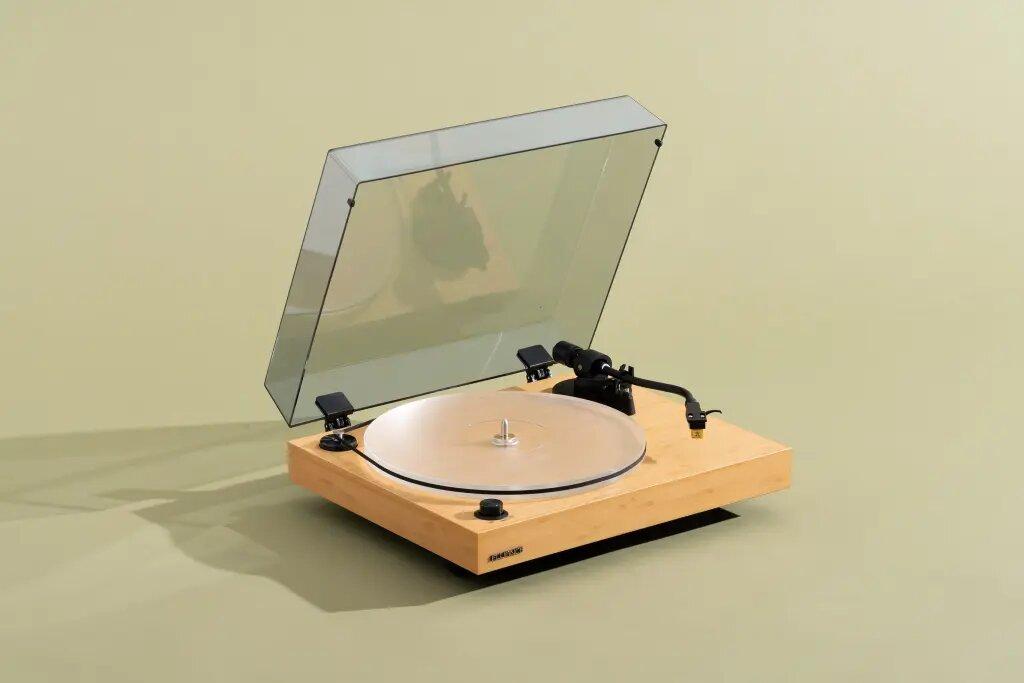 Record player isolated on green background